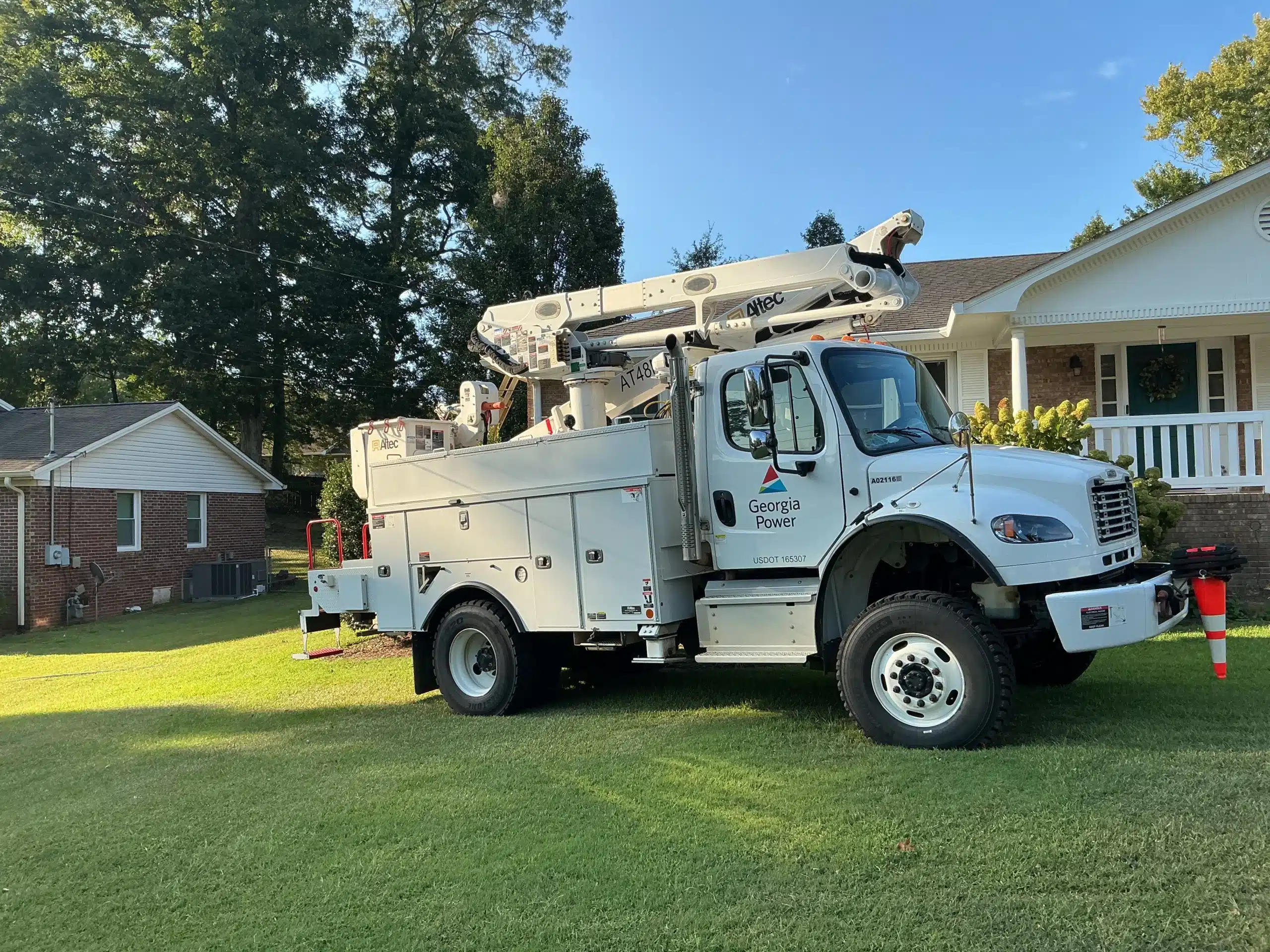 utility bucket truck working on residential electrical service